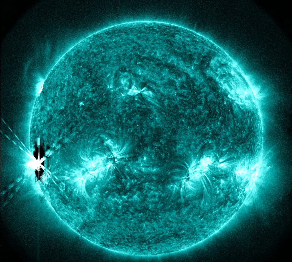 Near-Simultaneous Solar Flares Explode From Opposite Sides Of The Sun In Extremely Rare Event.